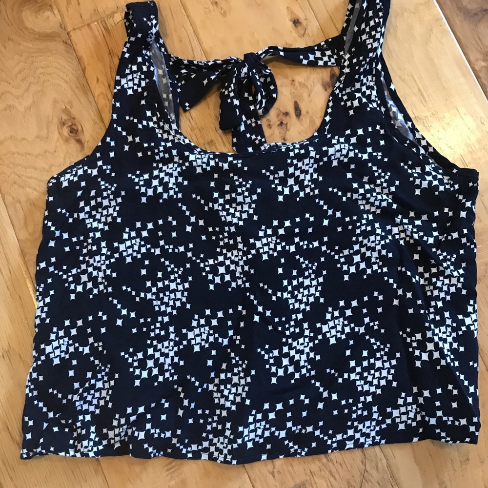 Blue tank top with tied bows on the back
